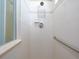 Clean shower with tile walls, grab bar, and multiple shower heads at 8078 Stirling Falls Cir, Sarasota, FL 34243