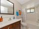A well-maintained bathroom featuring an updated vanity and a shower-tub combo at 8472 60Th N St # 702, Pinellas Park, FL 33781