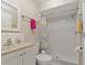 Bathroom featuring a white tiled shower, updated vanity, and fixtures that create a clean, modern look at 8472 60Th N St # 702, Pinellas Park, FL 33781