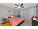 Bedroom with ceiling fan, good natural light, and comfortable decor, offering a welcoming space at 8472 60Th N St # 702, Pinellas Park, FL 33781