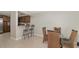 Inviting dining area offering counter-height seating and a dining table with room to accommodate Gathering and friends at 8472 60Th N St # 702, Pinellas Park, FL 33781