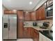 Modern kitchen featuring stainless steel appliances, granite countertops, and updated cabinets for your cooking convenience at 8472 60Th N St # 702, Pinellas Park, FL 33781