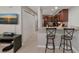 Stylish kitchen offering counter-height seating, updated cabinets, and easy access to the living spaces of this home at 8472 60Th N St # 702, Pinellas Park, FL 33781