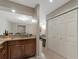 Kitchen view showcasing granite countertops, stainless steel sink, and an open layout into the living area at 8472 60Th N St # 702, Pinellas Park, FL 33781