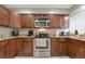 Updated kitchen featuring stainless steel appliances, granite countertops, and ample cabinet space to meet all your needs at 8472 60Th N St # 702, Pinellas Park, FL 33781