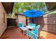 Cozy outdoor patio with ample seating, perfect for enjoying warm days and gentle breezes under a large umbrella at 8472 60Th N St # 702, Pinellas Park, FL 33781