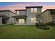 Spacious backyard featuring a covered patio and well-maintained lawn, perfect for outdoor living at 8815 Windlass Cv, Parrish, FL 34219