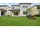 Picture of a beautiful yard with fresh grass and plants ready for entertaining and relaxation at 8815 Windlass Cv, Parrish, FL 34219
