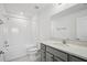 Clean bathroom with a shower/tub combo and vanity with grey cabinets at 8815 Windlass Cv, Parrish, FL 34219