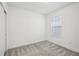 An empty, carpeted bedroom with a window at 8815 Windlass Cv, Parrish, FL 34219