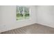 Bedroom with wood flooring and view of backyard at 8815 Windlass Cv, Parrish, FL 34219