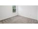Neutral bedroom with a window and plush carpeting, creating a cozy atmosphere at 8815 Windlass Cv, Parrish, FL 34219