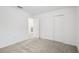 Spacious bedroom with neutral carpet, white walls, and a closet at 8815 Windlass Cv, Parrish, FL 34219