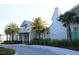 Community center adorned with lush palms provides residents with convenient access to community amenities at 8815 Windlass Cv, Parrish, FL 34219