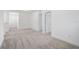 Upstairs living area with neutral carpet and white walls at 8815 Windlass Cv, Parrish, FL 34219