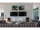 Community lounge featuring comfortable seating, TVs, and stylish decor for relaxation and entertainment at 8815 Windlass Cv, Parrish, FL 34219