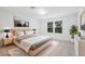 Nicely decorated bedroom with large windows, area rug, and stylish furniture at 8815 Windlass Cv, Parrish, FL 34219