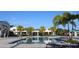 Beautiful community pool surrounded by palm trees provides a refreshing escape for residents at 8815 Windlass Cv, Parrish, FL 34219