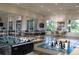 Game room features a variety of activities, including ping pong, foosball, and a chess/checkerboard table at 8815 Windlass Cv, Parrish, FL 34219