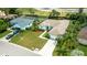 Aerial view of a charming single-Gathering home with mature landscaping and a long driveway at 9402 71St E Ave, Palmetto, FL 34221