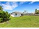 Spacious backyard showcasing a well-maintained lawn and wooden privacy fence at 9402 71St E Ave, Palmetto, FL 34221