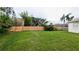 Spacious backyard with a well-maintained lawn and privacy fence, great for outdoor entertaining and recreation at 9402 71St E Ave, Palmetto, FL 34221