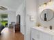 An ensuite bathroom adjacent to the main bedroom features a vanity and shower at 9402 71St E Ave, Palmetto, FL 34221