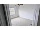 Carpeted bedroom featuring a window with blinds and ceiling fan at 9402 71St E Ave, Palmetto, FL 34221
