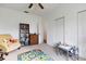 Bright bedroom with a colorful rug, bookshelf, stuffed animals, chair and small table set, perfect for a room at 9402 71St E Ave, Palmetto, FL 34221