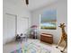 Bright bedroom featuring a play area with natural light streaming through the large window, offering a calm space at 9402 71St E Ave, Palmetto, FL 34221
