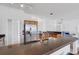 Bright and airy kitchen with a breakfast bar, stainless steel refrigerator, and wood cabinets for storage at 9402 71St E Ave, Palmetto, FL 34221