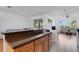 Open kitchen view with a breakfast bar, connecting to the living and dining areas at 9402 71St E Ave, Palmetto, FL 34221