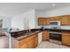 Modern kitchen with a stainless steel oven, microwave, and plenty of countertop space perfect for cooking at 9402 71St E Ave, Palmetto, FL 34221