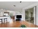 View of the open-concept living space with kitchen, breakfast bar, living room, and access to screened lanai at 9402 71St E Ave, Palmetto, FL 34221