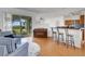 Open living space with wood floors, a piano, and a sliding glass door to the patio at 9402 71St E Ave, Palmetto, FL 34221