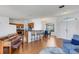 Bright living area featuring wood floors, a modern kitchen, and a comfortable seating area at 9402 71St E Ave, Palmetto, FL 34221