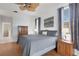 Comfortable main bedroom with ceiling fan, stylish furnishings, and ensuite access at 9402 71St E Ave, Palmetto, FL 34221