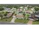 An aerial view of a single-story home featuring a well-manicured lawn and a beige tile roof at 107 Van Dyck Dr, Nokomis, FL 34275