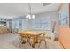 Cozy dining area with a round table, seating for four, and tile flooring at 107 Van Dyck Dr, Nokomis, FL 34275