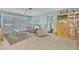 A well-lit living room with comfortable seating and tile flooring at 107 Van Dyck Dr, Nokomis, FL 34275