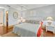 Cozy main bedroom with classic decor, featuring soft lighting, a comfortable bed, and a relaxing atmosphere at 107 Van Dyck Dr, Nokomis, FL 34275
