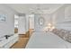 Spacious main bedroom bathed in soft light, offering a glimpse into the ensuite bathroom and a relaxing ambiance at 107 Van Dyck Dr, Nokomis, FL 34275