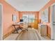 Office space with bright colored walls, offering a work area with a view and classic furnishings for a productive environment at 107 Van Dyck Dr, Nokomis, FL 34275