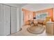 Home office area featuring peach colored walls, two work stations, and a large window allowing for plenty of natural light at 107 Van Dyck Dr, Nokomis, FL 34275