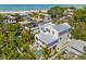 Stunning aerial view of a coastal home, highlighting a backyard pool and nearby beach access at 109 Palmetto Ave, Anna Maria, FL 34216