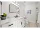 Modern bathroom with sleek vanity, black fixtures, and ample counter space at 109 Palmetto Ave, Anna Maria, FL 34216