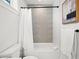 Bathroom with tub and tiled accent wall at 109 Palmetto Ave, Anna Maria, FL 34216