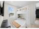 Bedroom with a bunk bed and shelves at 109 Palmetto Ave, Anna Maria, FL 34216