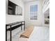 Bedroom with TV and console table at 109 Palmetto Ave, Anna Maria, FL 34216