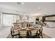 Great room with kitchen, dining and living room featuring an open and airy layout at 109 Palmetto Ave, Anna Maria, FL 34216